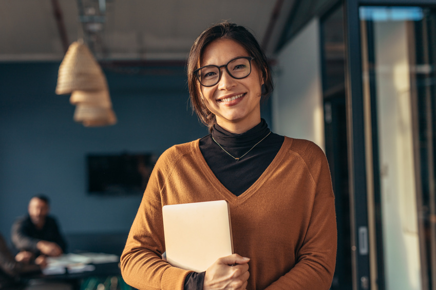 Smiling Woman in Casuals in Office